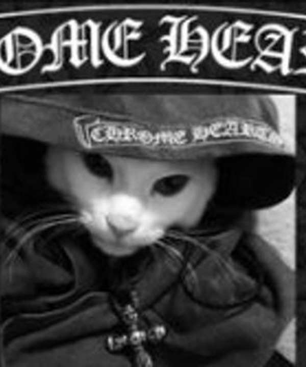 Chrome Hearts cat mascot in a black hat with a silver cross pendant